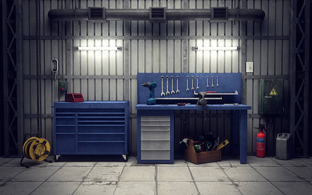 Workshop tool wall with spanners hung in ordered rows above a bench