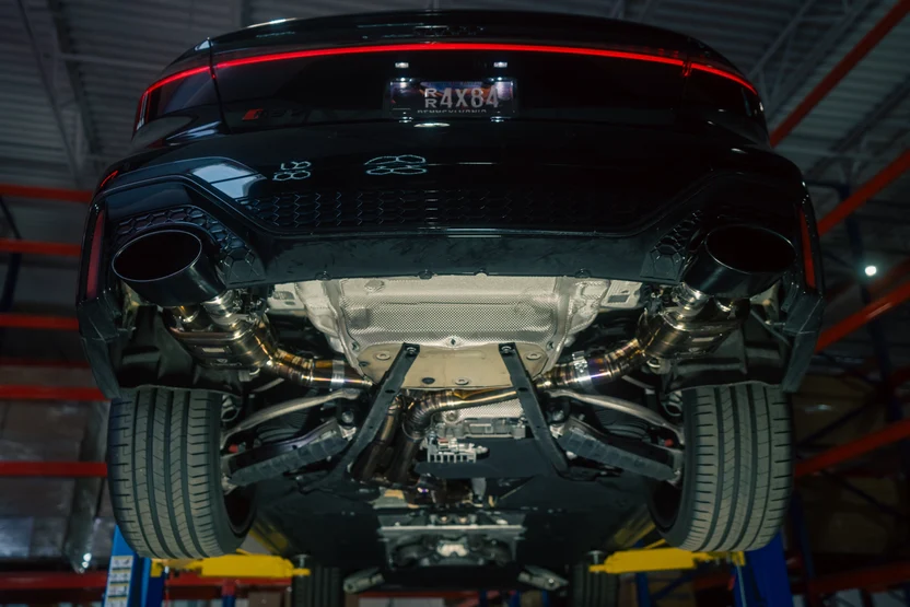 Exhaust outlets and underbody of the Audi RS6 C8 on a lift
