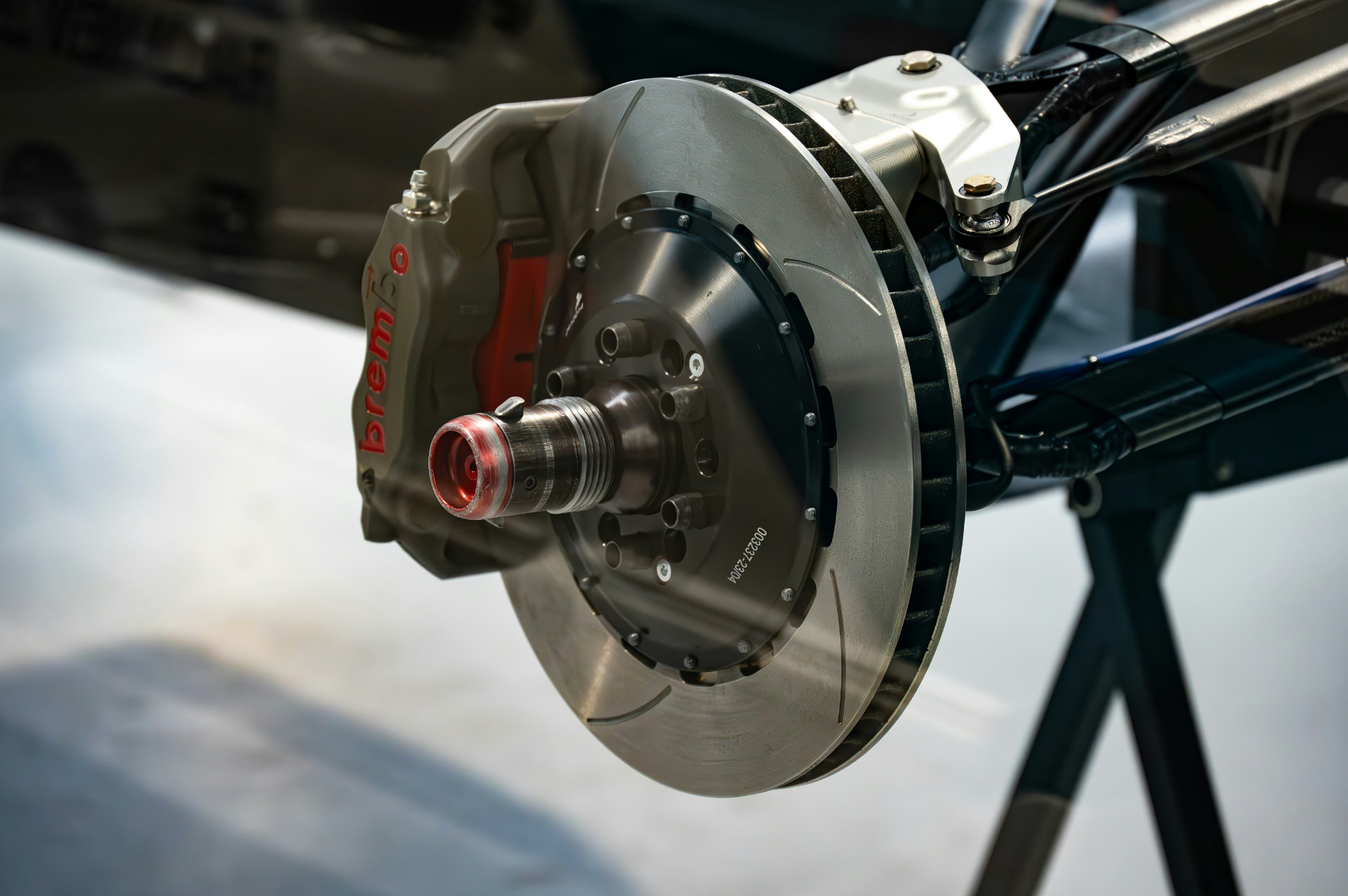 Brake caliper, slotted disc and hub assembly under inspection